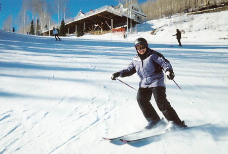 Mom skiing with smile