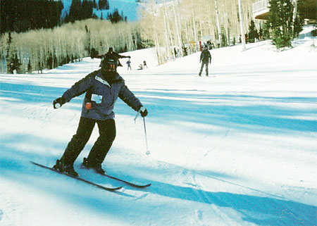 Mom skiing racing style